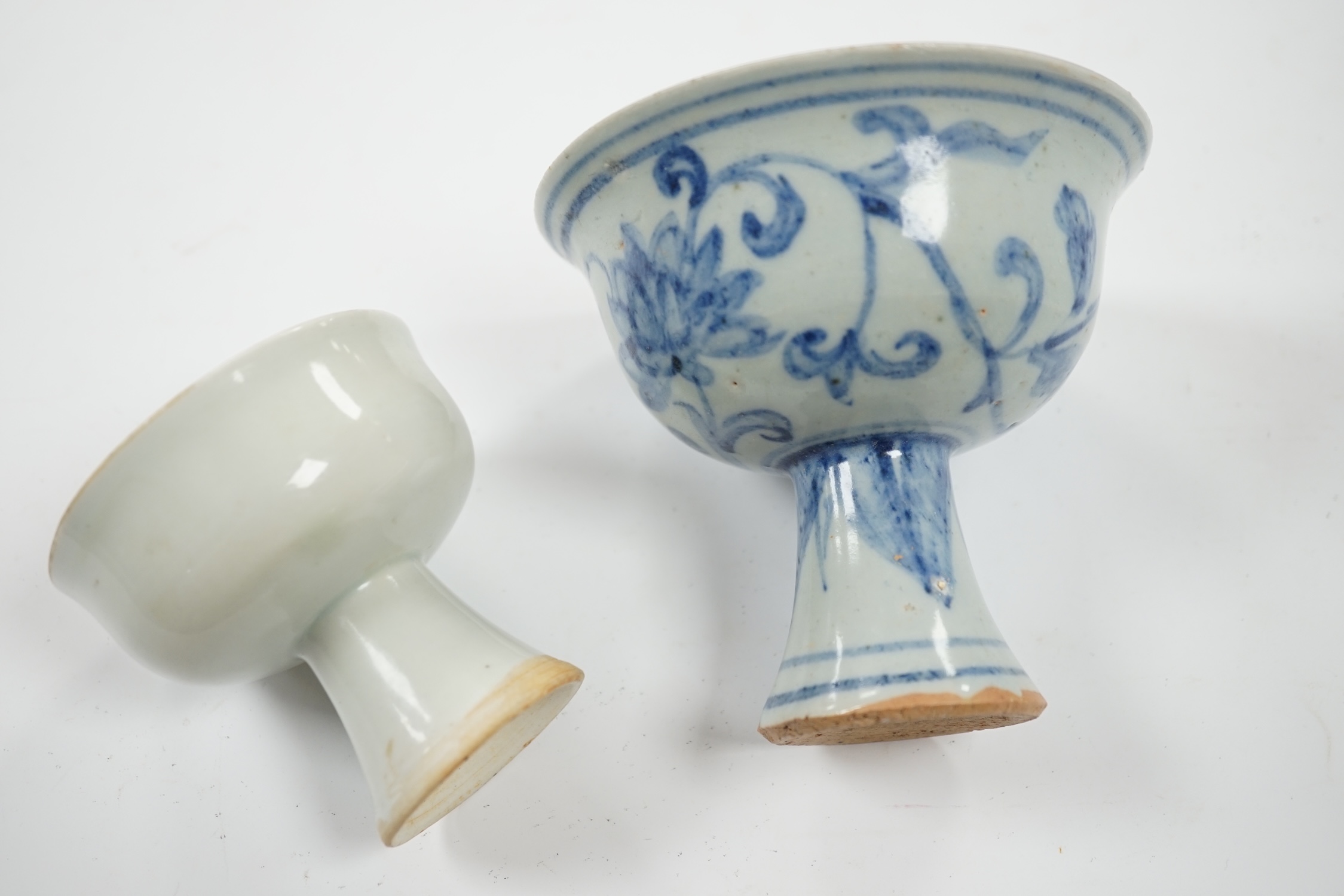 Two Chinese stem cups including a blue and white example, 10.5cm. Condition - fair to good